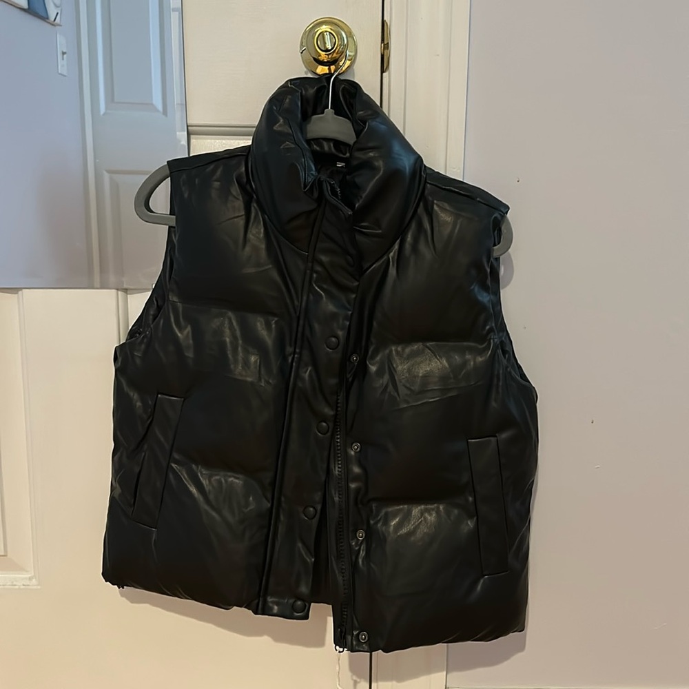 Medium south moon under black vest.
